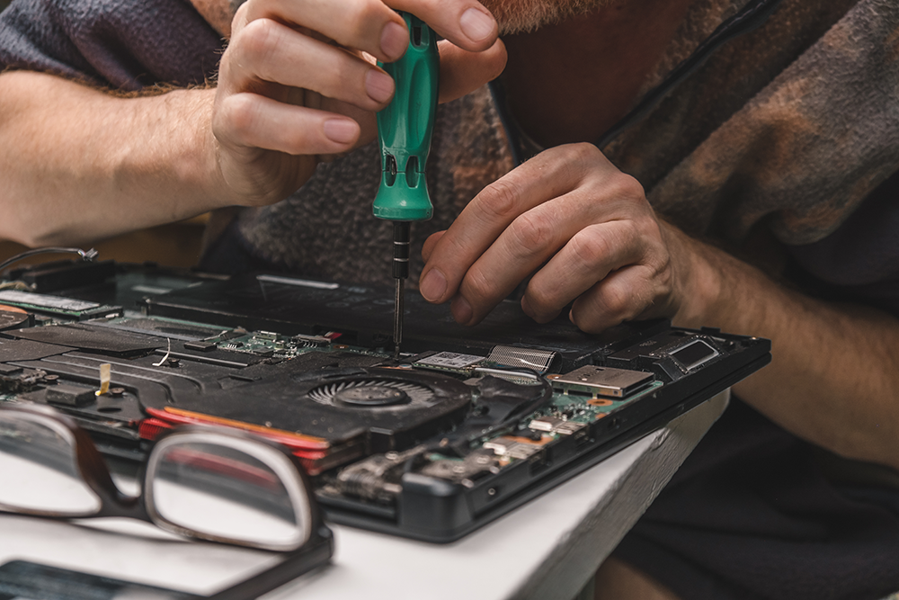 Man cleaning a computer